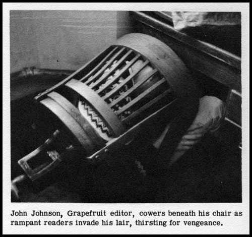 John Johnson hiding under a chair
